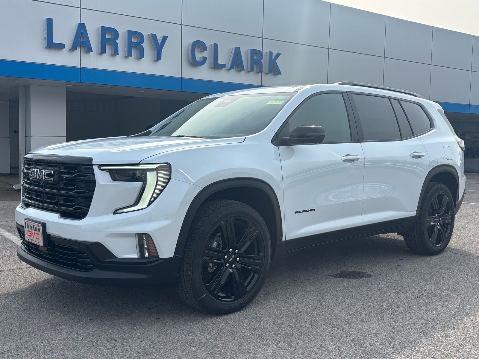 2026 GMC Acadia Elevation in Glacier White Tricoat — front three-quarter view