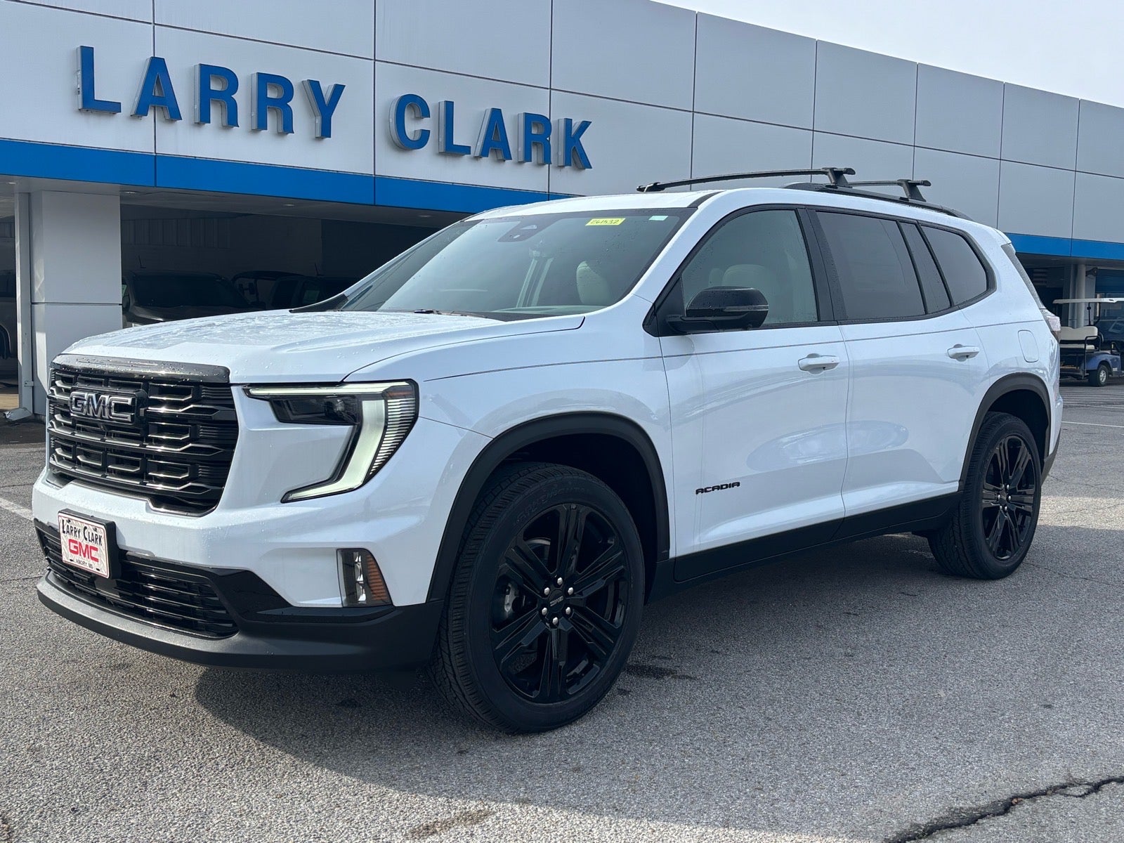 2026 GMC Acadia Elevation in Glacier White Tricoat — front three-quarter view
