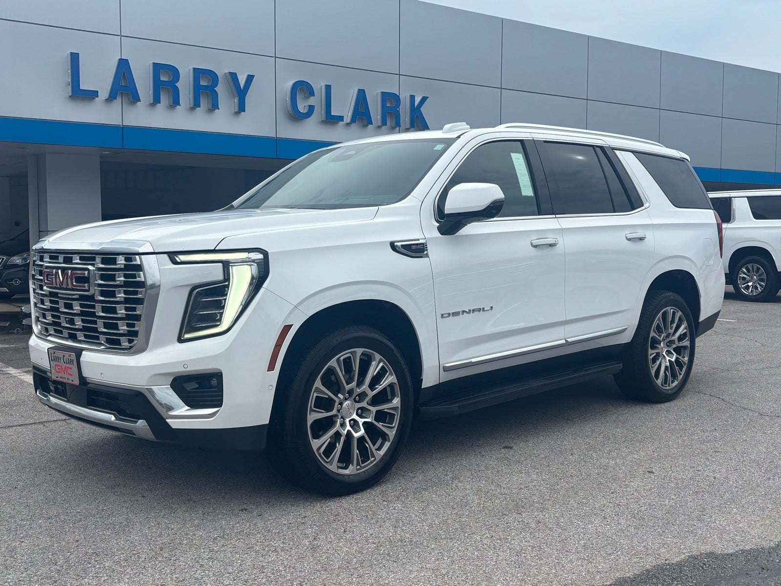 2025 GMC Yukon Denali in Summit White — front three-quarter view
