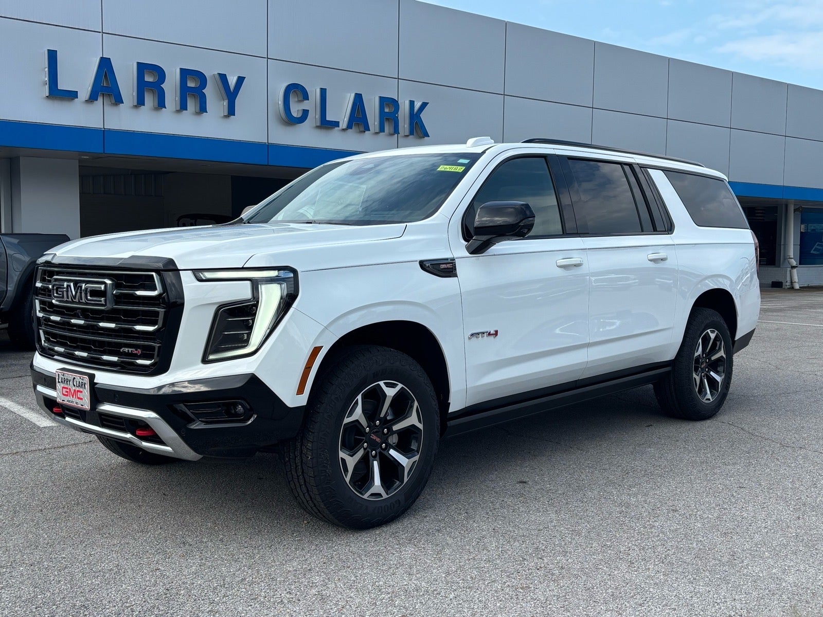 2026 GMC Yukon XL AT4 in Summit White — front three-quarter view