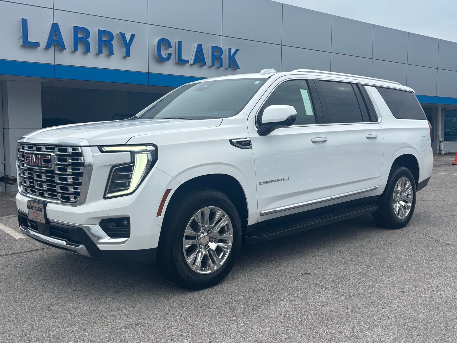 2025 GMC Yukon XL Denali in Summit White — front three-quarter view