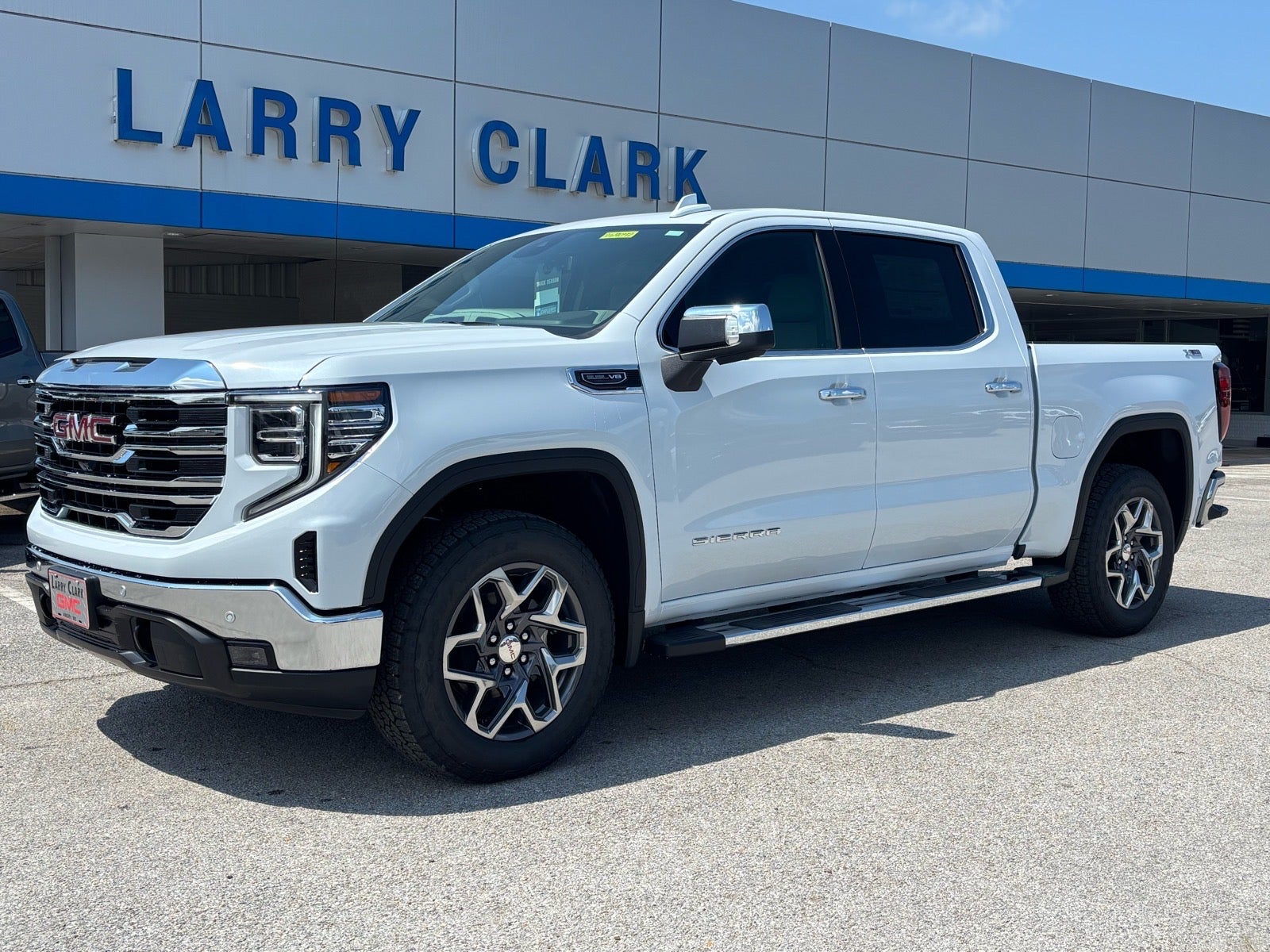2026 GMC Sierra 1500 SLT in Glacier White Tricoat — front three-quarter view