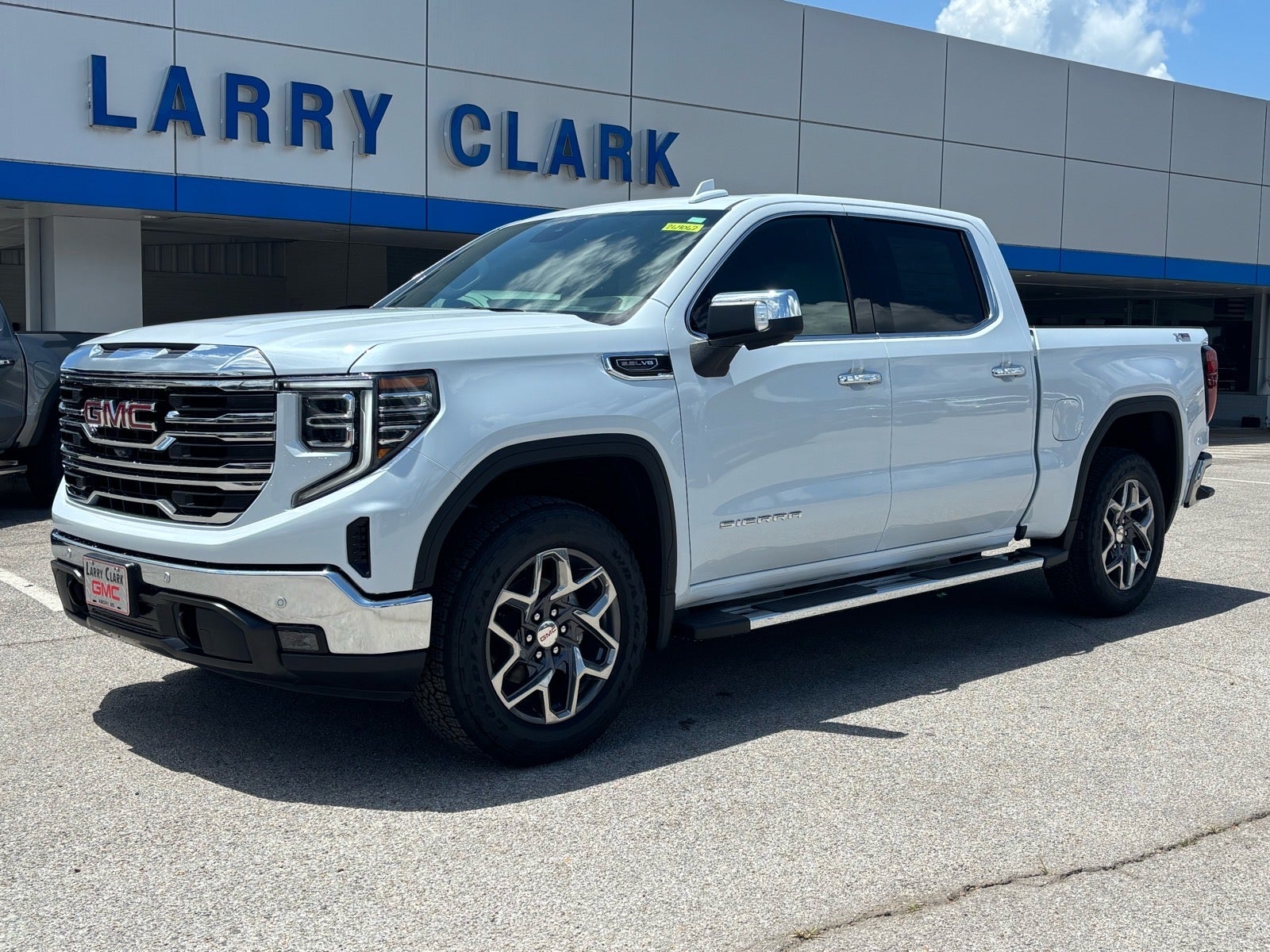 2026 GMC Sierra 1500 SLT in Glacier White Tricoat — front three-quarter view