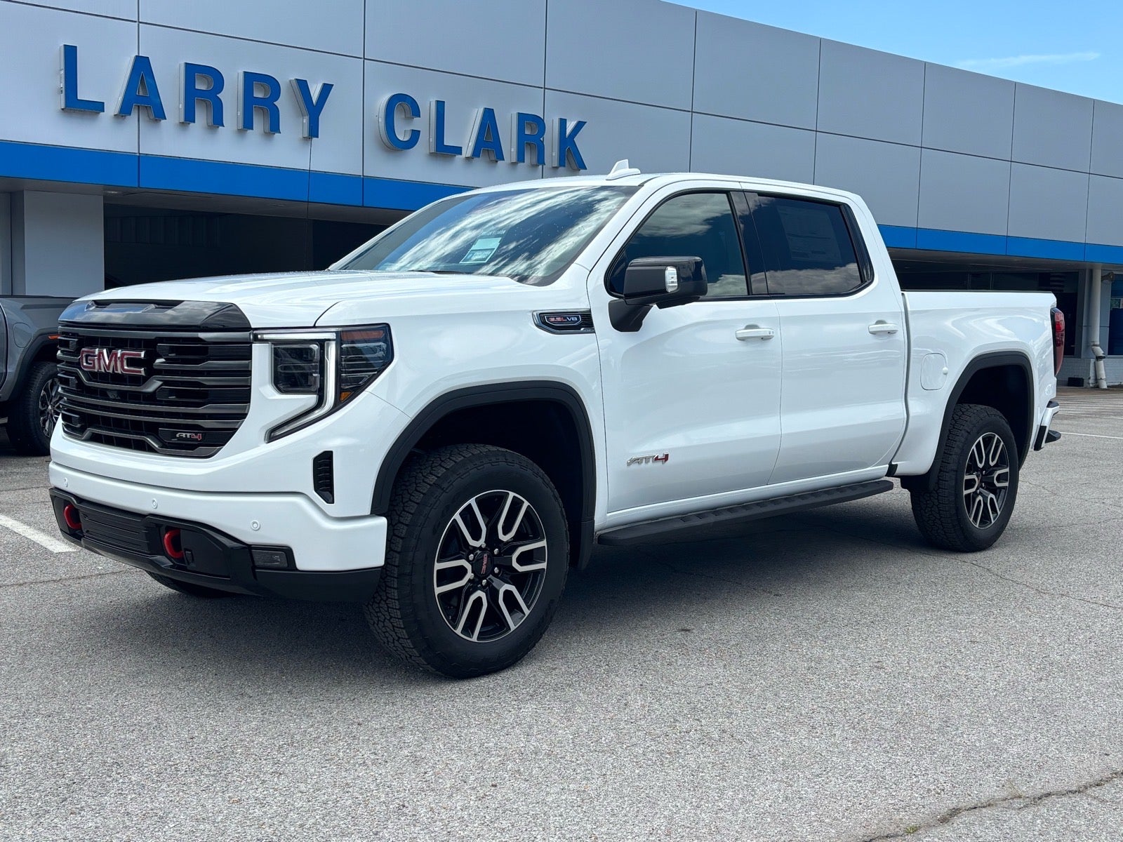 2026 GMC Sierra 1500 AT4 in Summit White — front three-quarter view