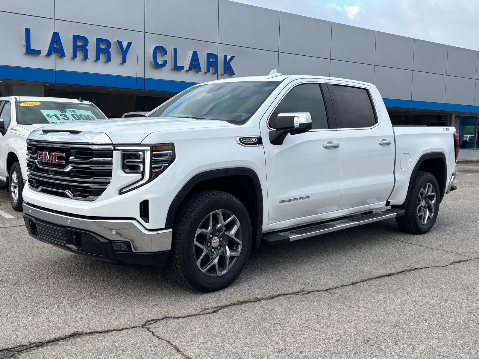 2026 GMC Sierra 1500 SLT in Summit White — front three-quarter view