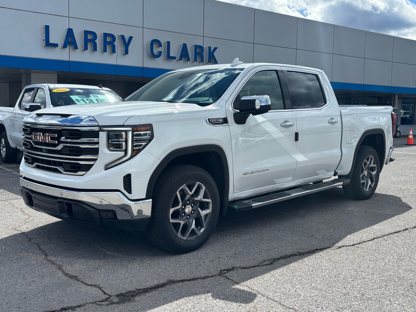 2026 GMC Sierra 1500 SLT in Summit White — front three-quarter view